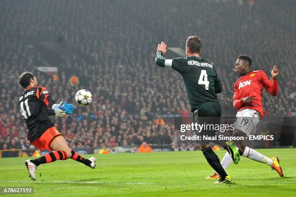 Manchester United's Danny Welbeck has a shot on target past Real Madrid goalkeeper Diego Lopez and Sergio Ramos