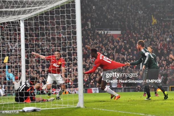 Real Madrid goalkeeper Diego Lopez makes a save from Manchester United's Danny Welbeck