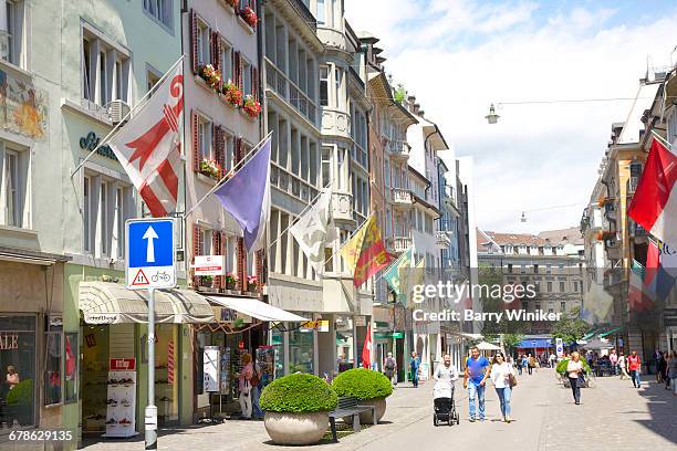 colorful flags on rennweg in old town, zurich - rennweg stock pictures, royalty-free photos & images