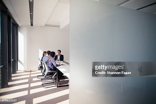 business meeting behind wall in conference room - konferenzraum stock-fotos und bilder