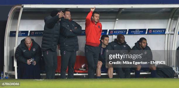Paris Saint-Germain's David Beckham watches the action from the bench