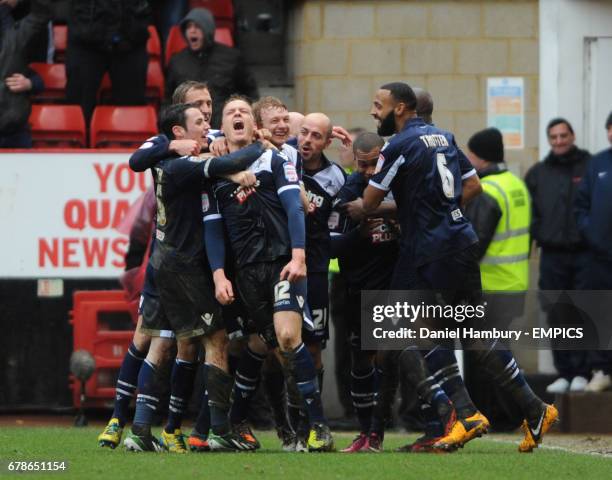 Millwall's Shane Lowry is mobbed by team mates after scoring the second goal