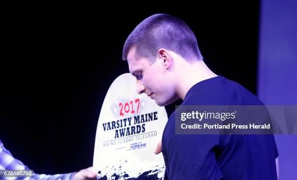 Austin Dutremble, of Biddeford High School, accepts the Role Model award during the 2017 Varsity Maine Awards.