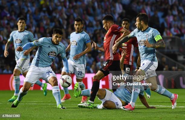 Jesse Lingard of Manchester United is watched by the Celta Vigo defence during the UEFA Europa League semi final, first leg match between Celta Vigo...