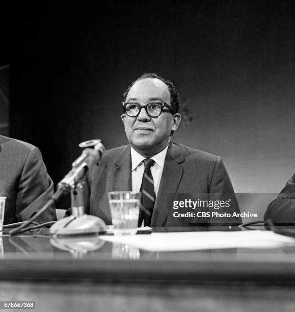 Langston Hughes, poet and columnist for The New York Post newspaper , asks questions of the panel on the civic and current affairs television...