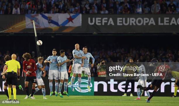 Marcus Rashford of Manchester United scores their first goal with a free kick during the UEFA Europa League semi final, first leg match between Celta...