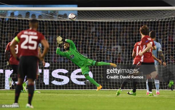 Sergio Alvarez of Celta Vigo fails to stop Marcus Rashford of Manchester United from scoring their first goal during the UEFA Europa League semi...