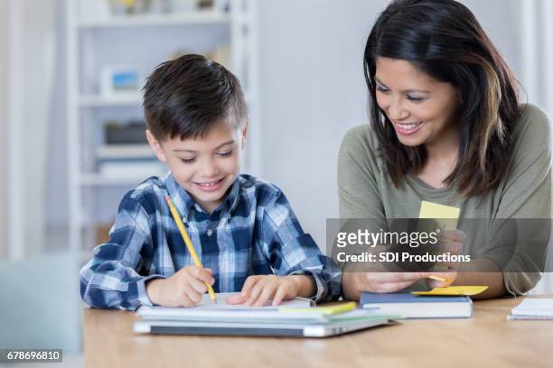 cheerful mom homeschools young son - flash card stock pictures, royalty-free photos & images