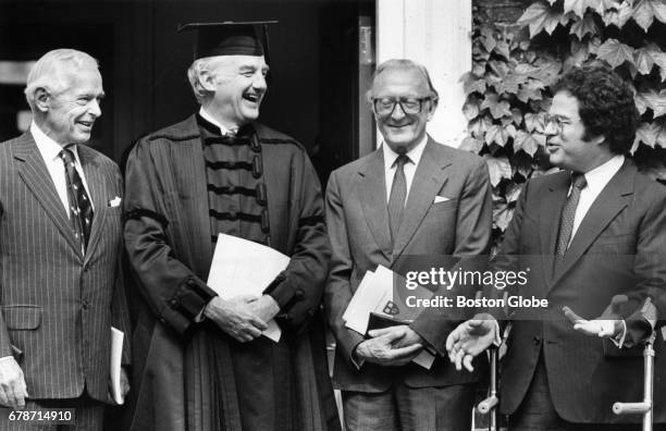 From left, Paul Nitze, Harvard President Derek Bok, Lord Carrington and Itzhak Perlman before the start of the Harvard Commencement in Cambridge,...