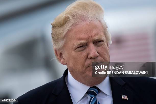 President Donald Trump boards Air Force One at Andrews Air Force base on May 4, 2017. - Trump is heading to New York, NY.