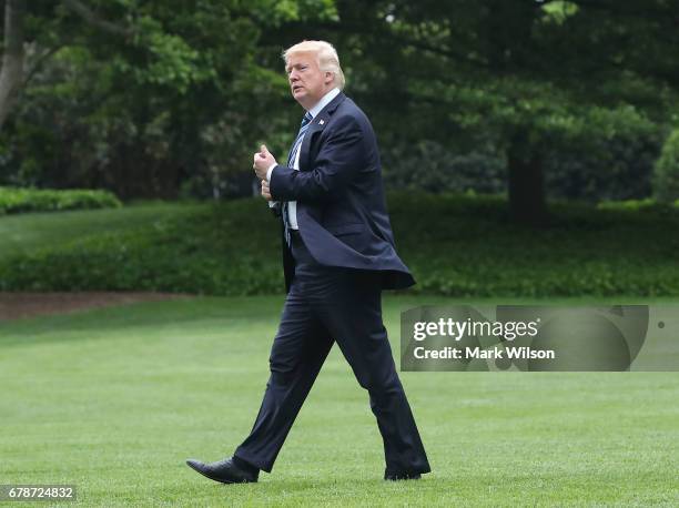 President Donald Trump walks out of the Oval Office toward Marine One while departing the White House on May 4, 2017 in Washington, DC. President...