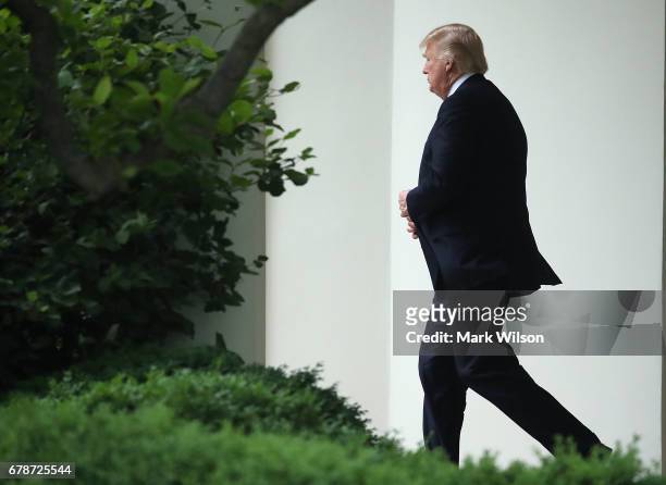 President Donald Trump walks out of the Oval Office toward Marine One while departing the White House on May 4, 2017 in Washington, DC. President...