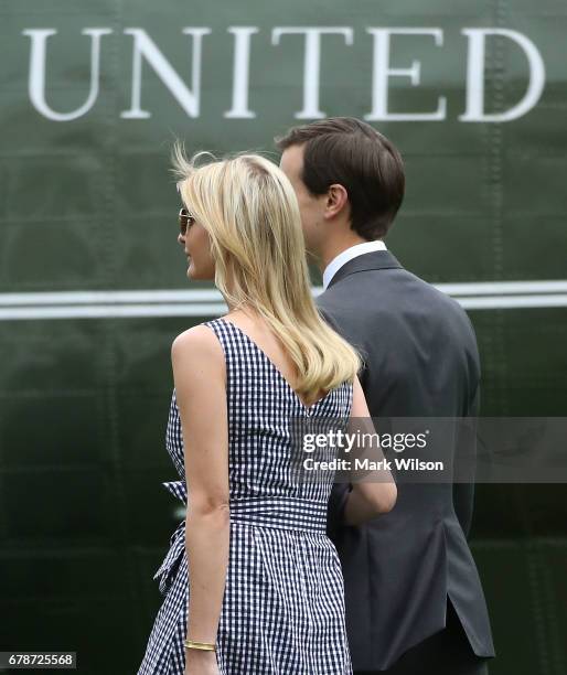 White House Senior Adviser Jared Kushner walks with his wife Ivanka Trump as they depart with President Donald Trump on Marine One at the White House...