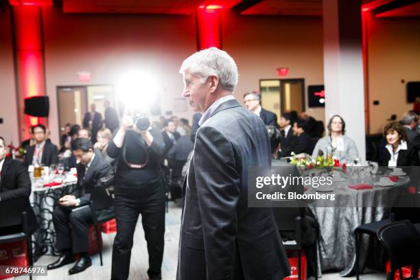 Rick Snyder, governor of Michigan, walks off stage during a grand opening ceremony at the expanded Toyota Motor North American Research & Development...