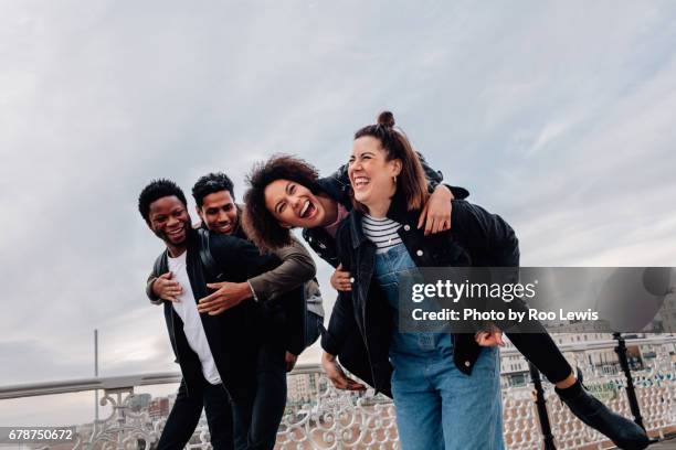 seaside couples - four people smiling foto e immagini stock