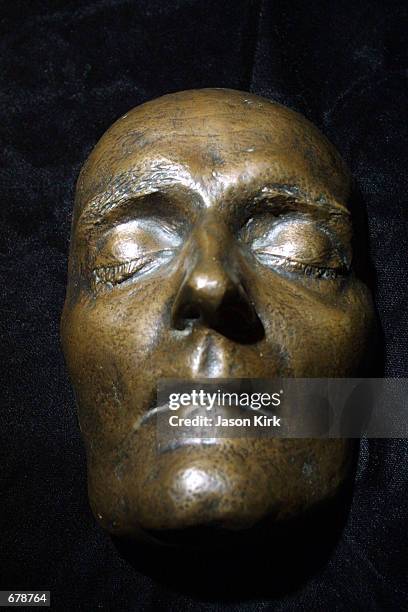 Patinated bronze death mask of Napoleon Bonaparte is on display during a Los Angeles auction preview November 2, 2001 at Butterfileds in Los Angeles,...