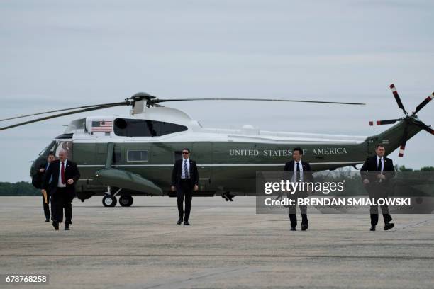 Members of the Secret Service arrive to board Air Force One to escort US President Donald Trump at Andrews Air Force Base May 4, 2017 in Maryland. /...