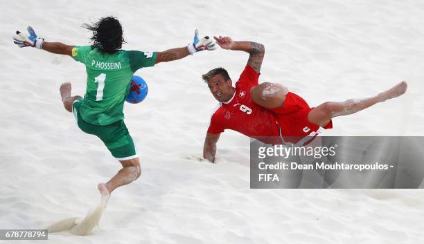 Dejan Stankovic of Switzerland attempts a scissor or bicycle kick shot on goal in front of Goalkeeper, Peyman Hosseini of Iran during the FIFA Beach...