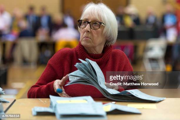 Woman counts ballot papers at Llanishen Leisure Centre on May 4, 2017 in Cardiff, Wales. A total of 4,851 council seats are up for grabs in 88...