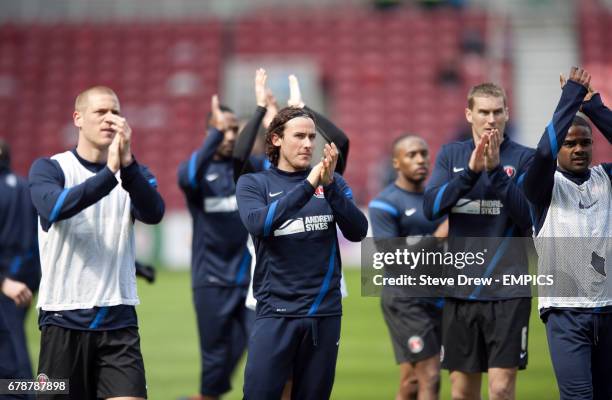 Charlton Athletic's Lawrie Wilson and his team-mates applaud the travelling fans after their warm up