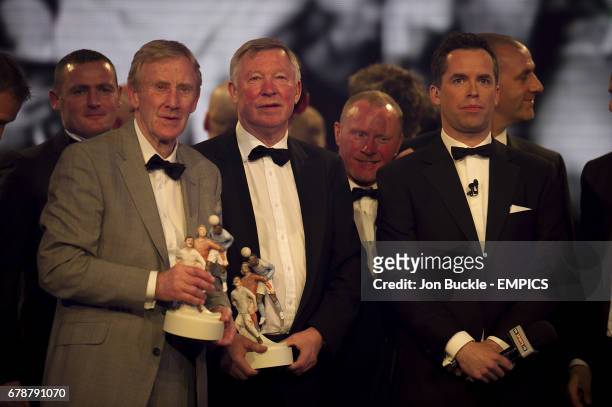 Manchester United's Youth Team manager Eric Harrison and manager Sir Alex Ferguson with their PFA Merit Award trophies alongside David Jones