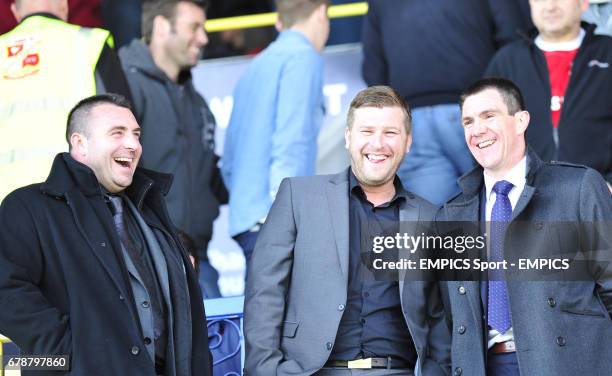 Sheffield United's caretaker manager Chris Morgan , assistant David Unsworth and Milton Keynes Dons manager Karl Robinson in the stands