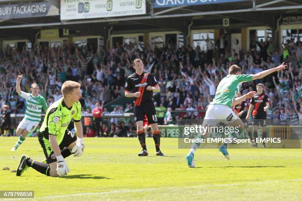 Sheffield United goalkeeper George Long is left dejected after Yeovil Town's Kevin Dawson scores their first goal of the game