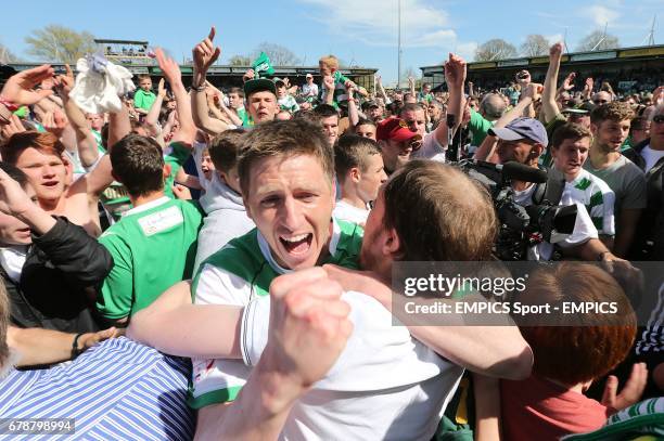 Yeovil Town's Richard Hinds is mobbed by fans after the final whistle