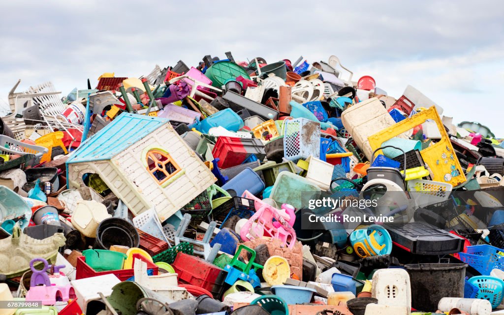A mountain of plastic goods at a recycling plant