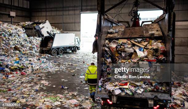 dumping trucks at a recycling plant - waste management stock pictures, royalty-free photos & images