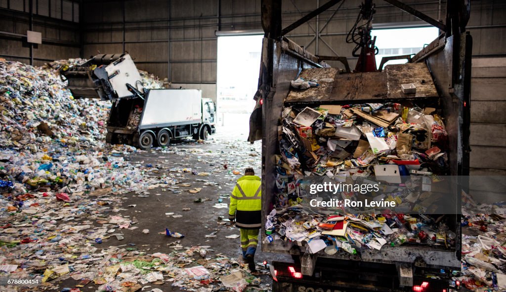 Dumping trucks at a recycling plant