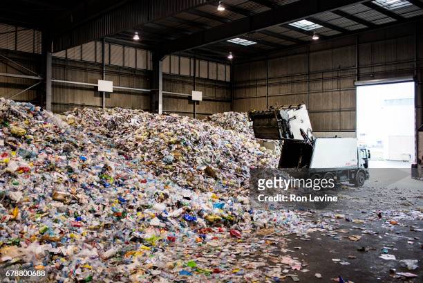 dumping trucks at a recycling plant - waste management stock pictures, royalty-free photos & images