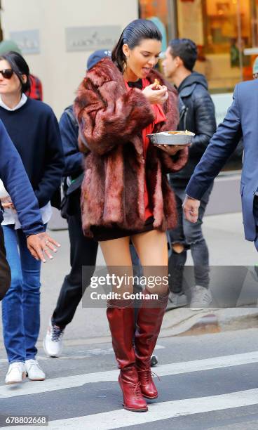 Kendall Jenner eats some food during a photoshoot on May 4, 2017 in New York City.