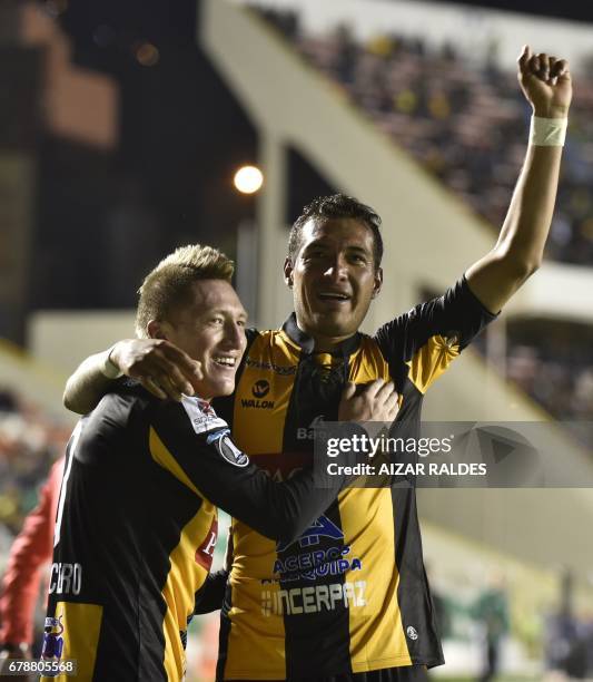 Bolivia's The Strongest players Walter Veizaga and Alejandro Chumacero celebrate after scoring against Peru's Sporting Cristal during their Copa...
