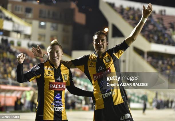 Bolivia's The Strongest players Walter Veizaga and Alejandro Chumacero celebrate after scoring against Peru's Sporting Cristal during their Copa...