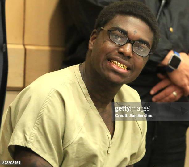 Rapper Kodak Black is all smiles during his sentencing hearing in connection with a violation of his house arrest, in Fort Lauderdale, Fla., on...