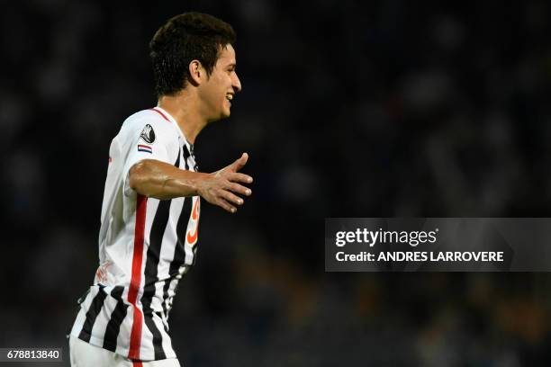 Paraguay's Libertad player Danilo Santacruz celebrates after scoring his first goal against Argentina's Godoy Cruz during their Copa Libertadores...