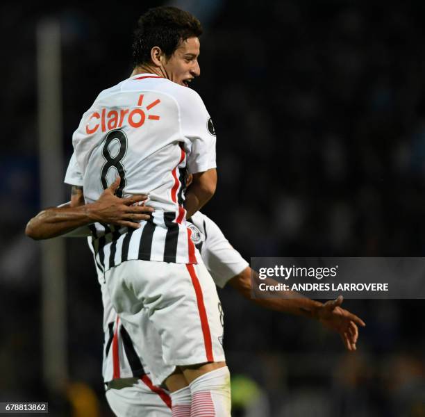 Paraguay's Libertad player Danilo Santacruz celebrates after scoring his first goal against Argentina's Godoy Cruz during their Copa Libertadores...