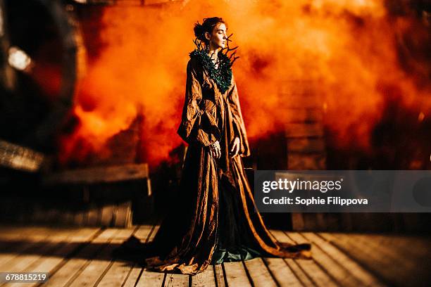 caucasian woman wearing branch necklace and dress on stage - theatre costume stock pictures, royalty-free photos & images