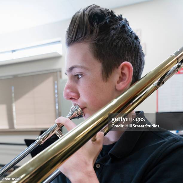 Trombone Class 97 Boy Playing Trombone Stock Photos, High-Res Pictures, and Images ...