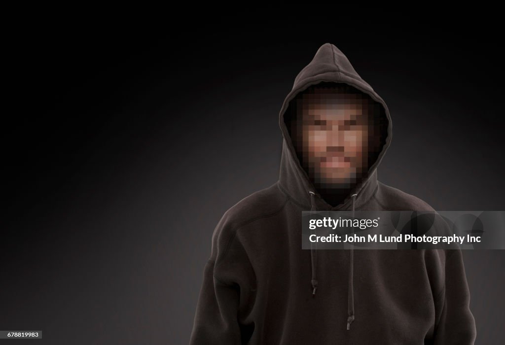 Pixelated face of Caucasian man wearing hooded sweatshirt