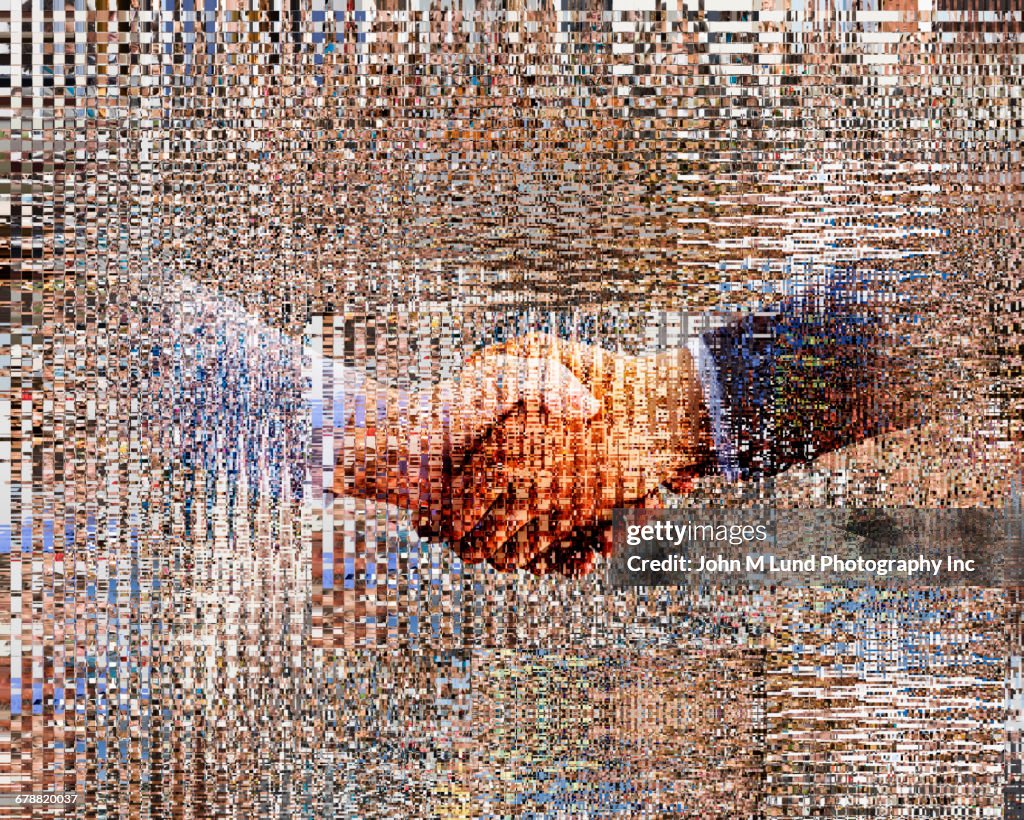 Pixelated hands of businessmen shaking hands