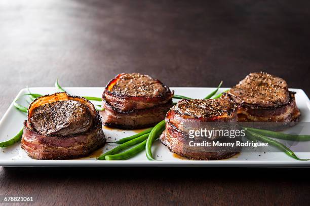 filet mignon wrapped in bacon - filet mignon stock pictures, royalty-free photos & images