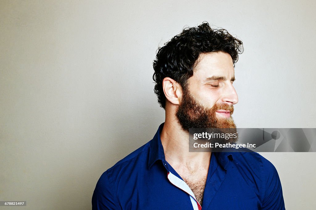 Caucasian man with beard with eyes closed