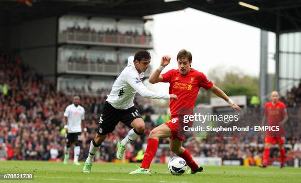 Fulham's Bryan Ruiz and Liverpool's Sebastian Coates battle for the ball