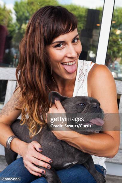 caucasian woman imitating dog with tongue out - concord massachusetts stock pictures, royalty-free photos & images