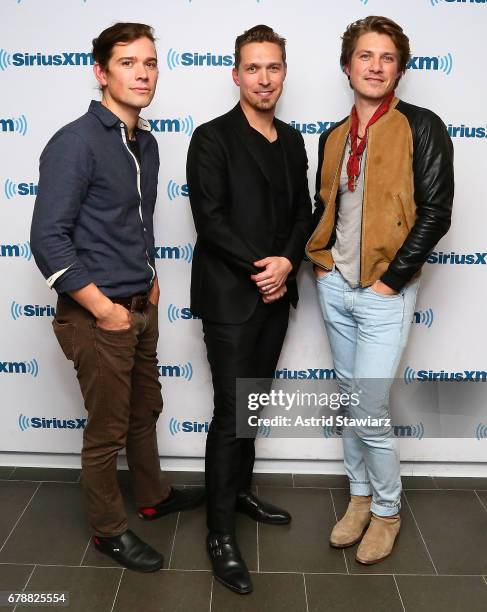 Zac Hanson, Isaac Hanson and Taylor Hanson of the band Hanson visits the SiriusXM Studios on May 4, 2017 in New York City.