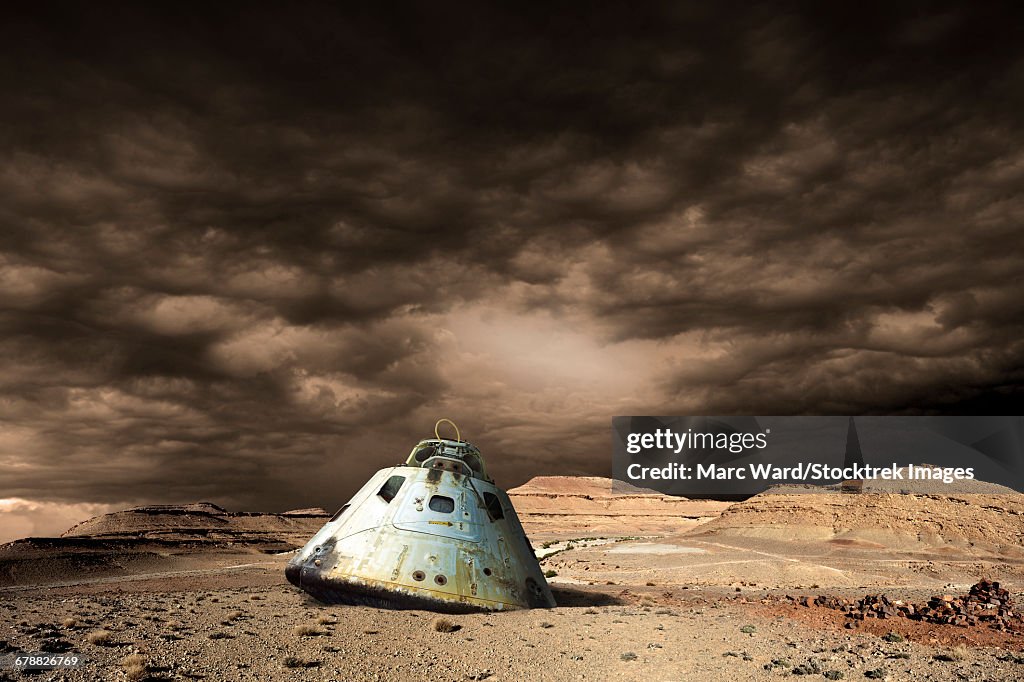 A scorched space capsule lies abandoned on a barren world. 