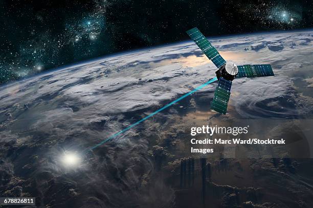 a composite image of a satellite firing an energy weapon at a target on earth. - space war stock illustrations