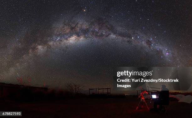 astronomer with a telescope looking at the milky way in the atacama desert, chile. - observatory stock pictures, royalty-free photos & images